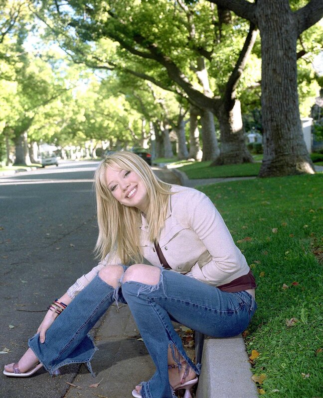 woman sitting on a curb
