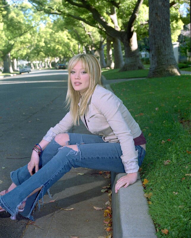 woman sitting on a curb
