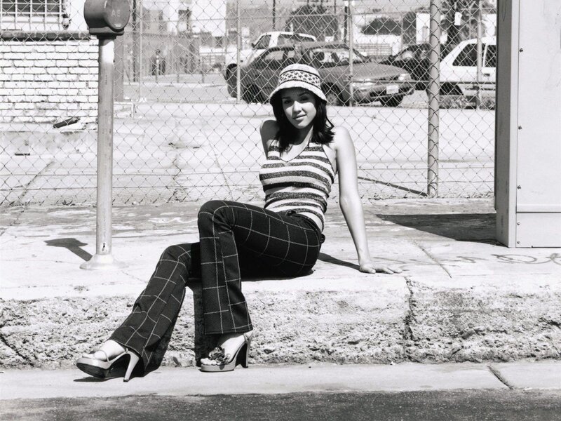 woman sitting on a curb