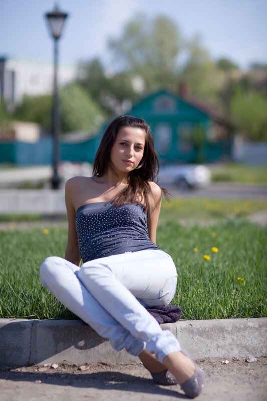 woman sitting on a curb