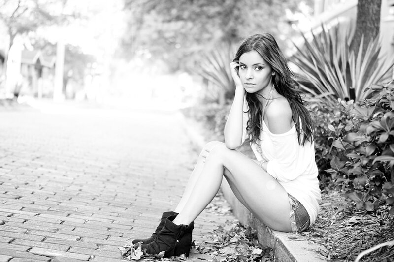 woman sitting on a curb