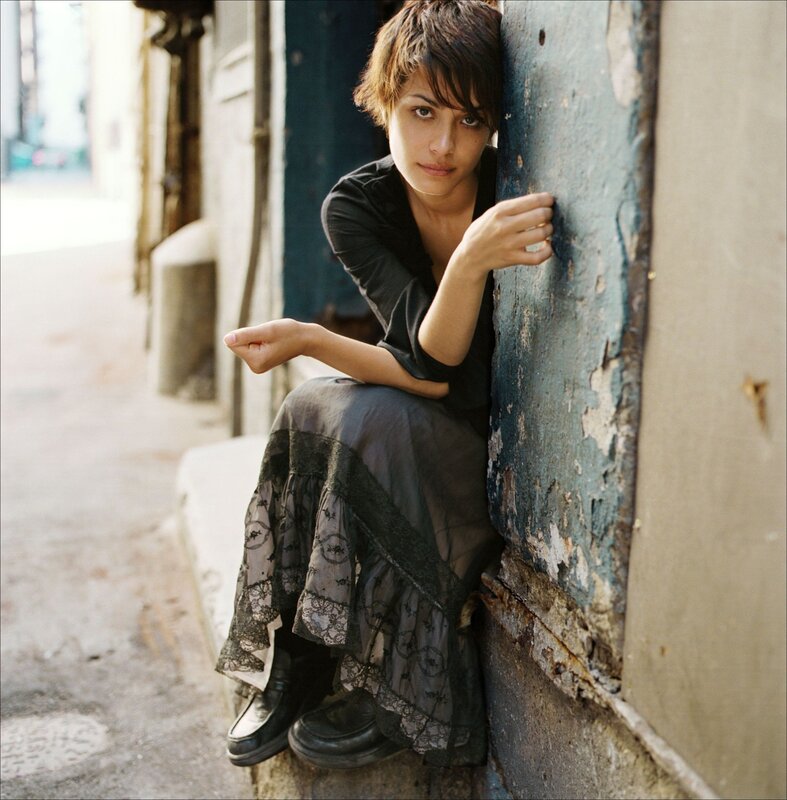 woman sitting on a curb