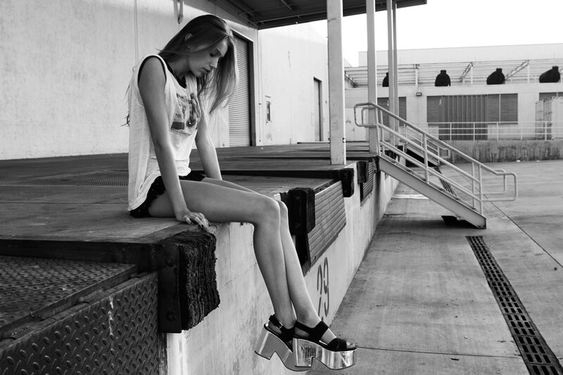 woman sitting on a dock