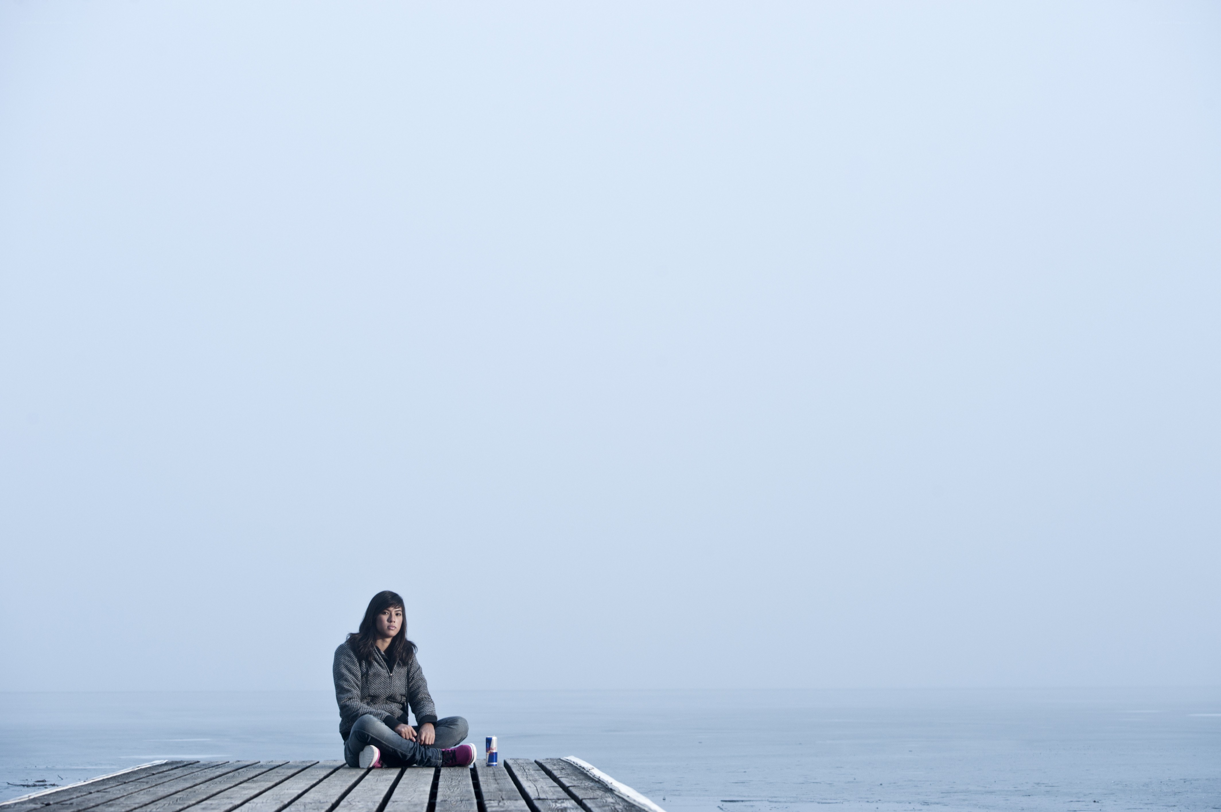 Woman sitting on a dock