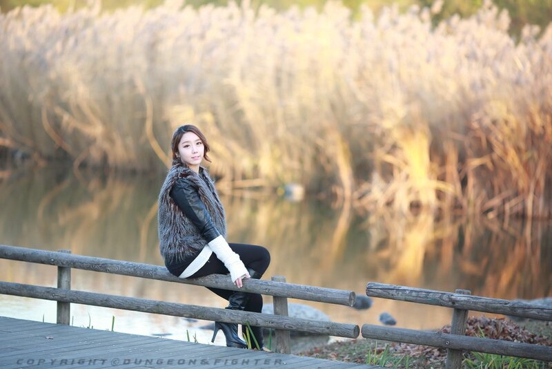 Woman sitting on a dock by the water