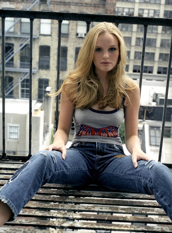 woman sitting on a fire escape