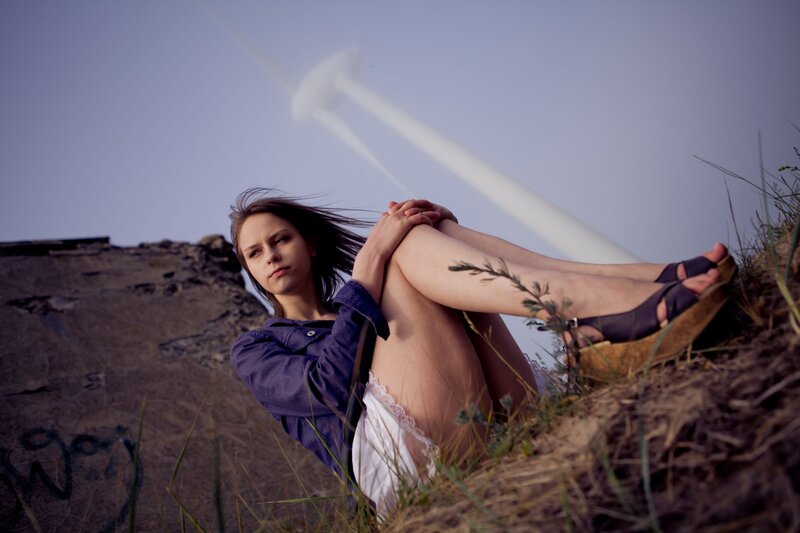Woman sitting on a hillside