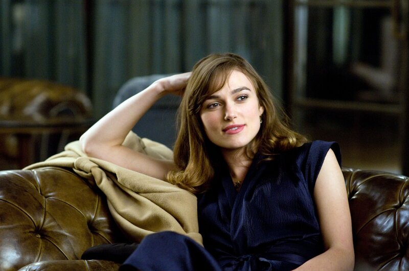 woman sitting on a leather couch