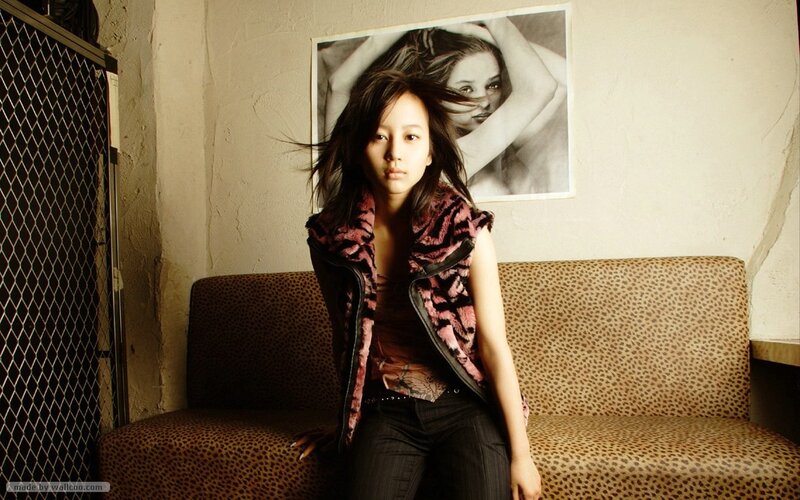 woman sitting on a leopard-print couch
