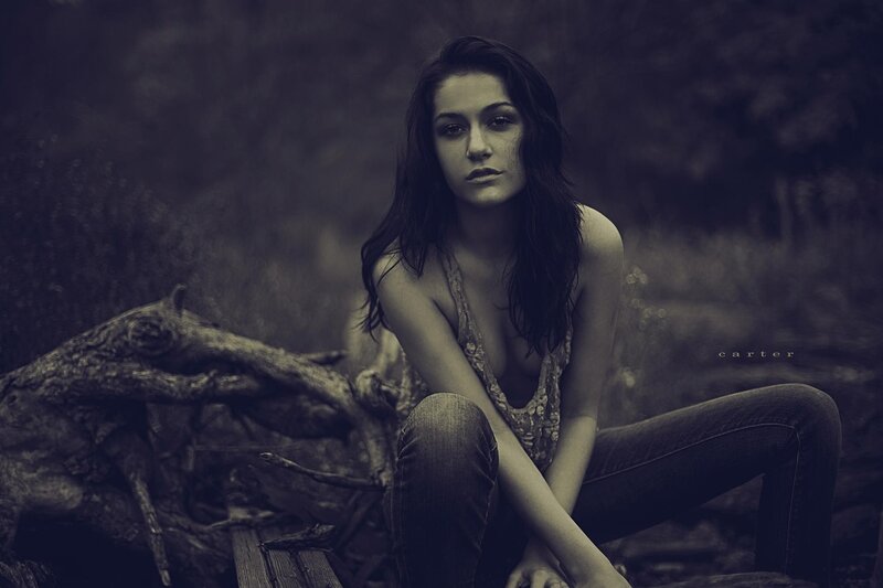 woman sitting on a log