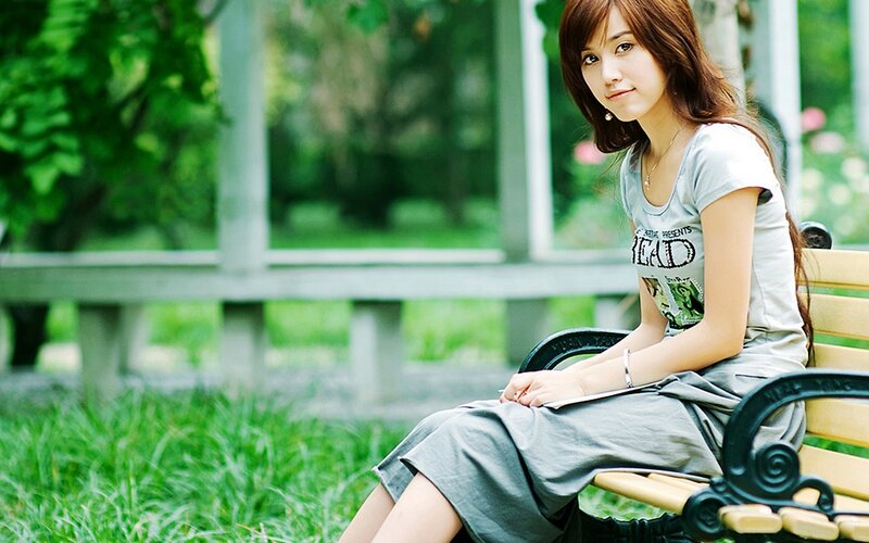 woman sitting on a park bench