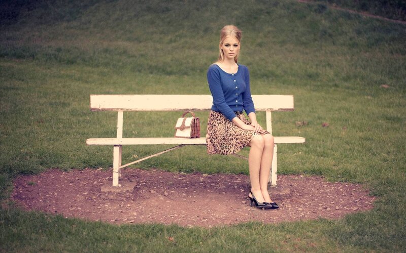 woman sitting on a park bench
