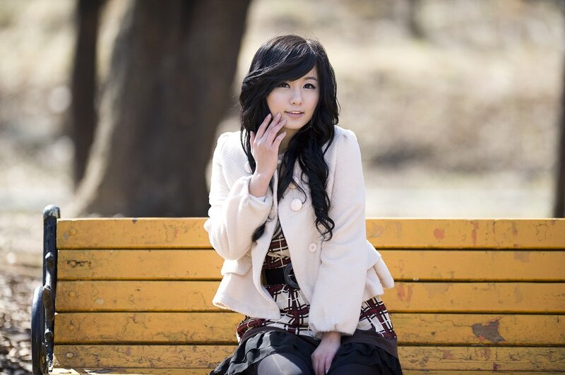 woman sitting on a park bench