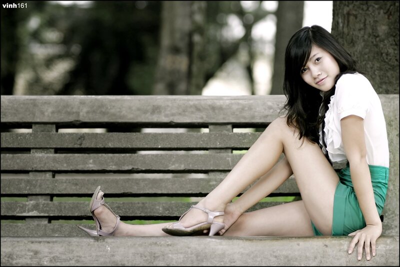 woman sitting on a park bench