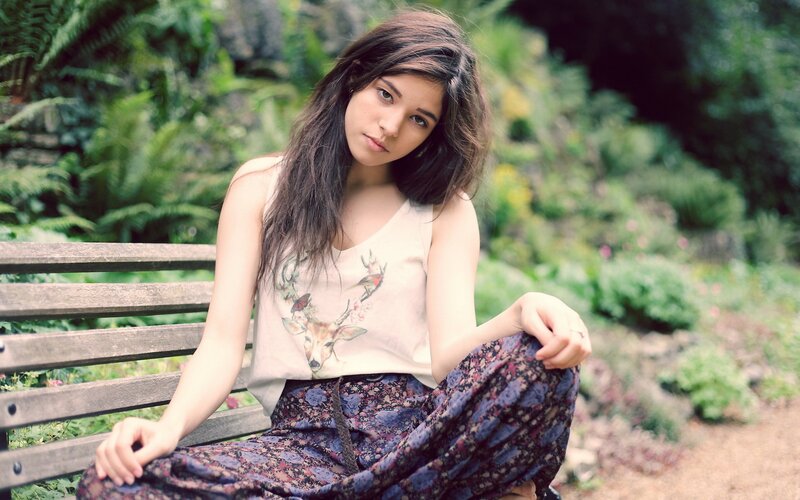woman sitting on a park bench