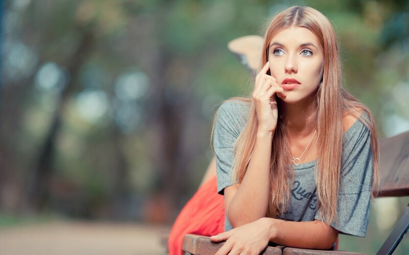 woman sitting on a park bench