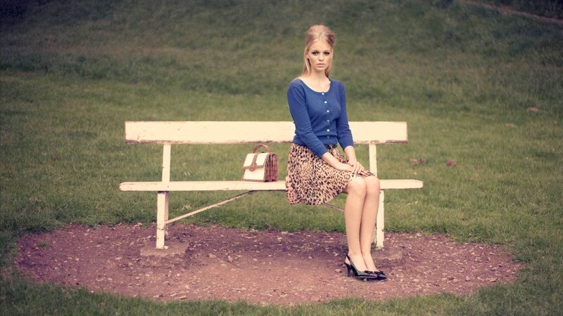 woman sitting on a park bench