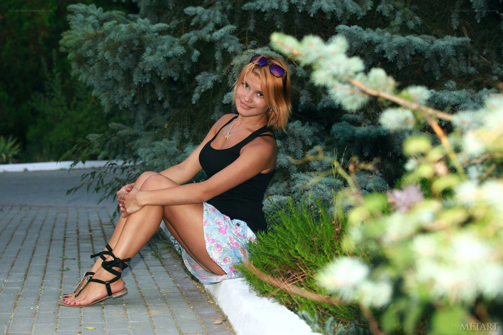 woman sitting on a path