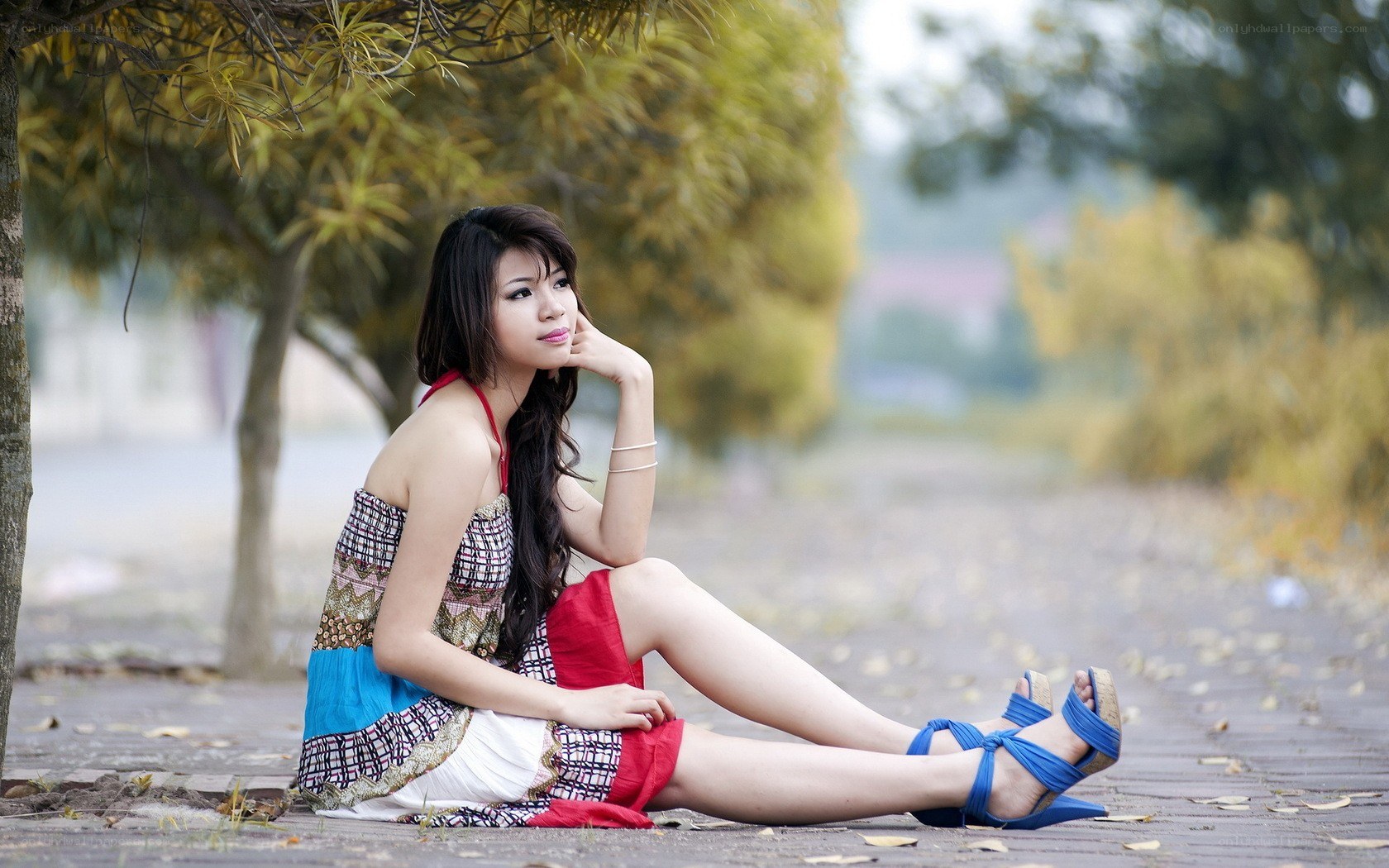 woman sitting on a path