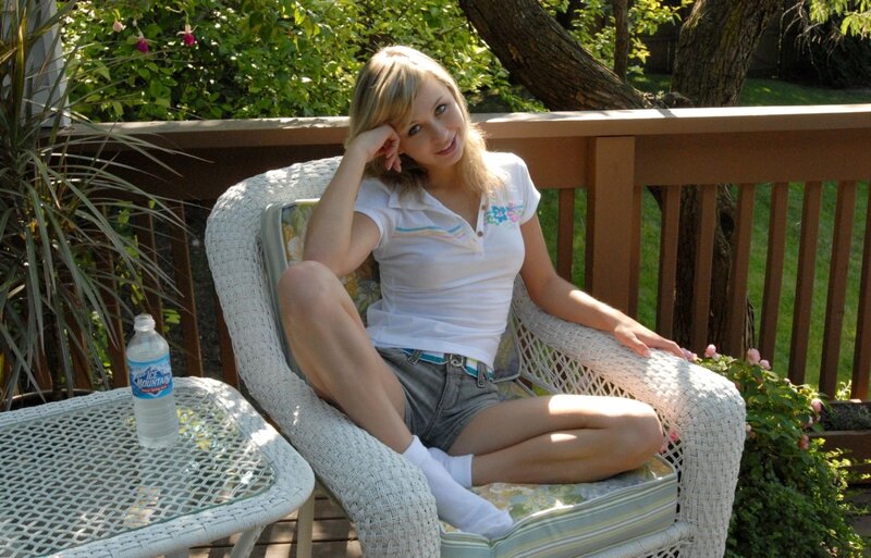 Woman sitting on a patio chair