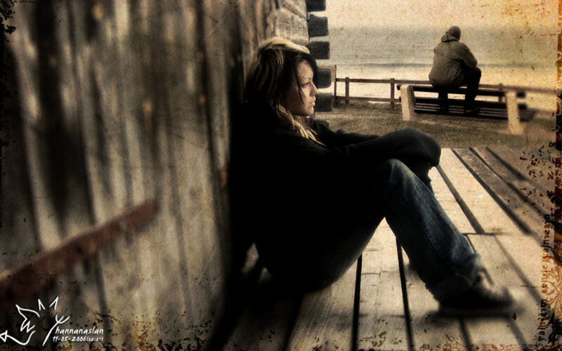 woman sitting on a pier