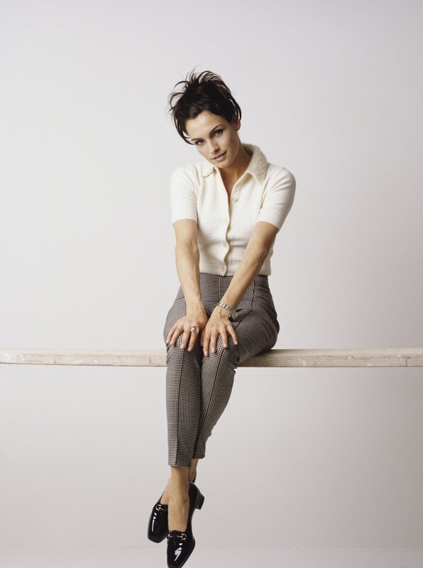 woman sitting on a rail