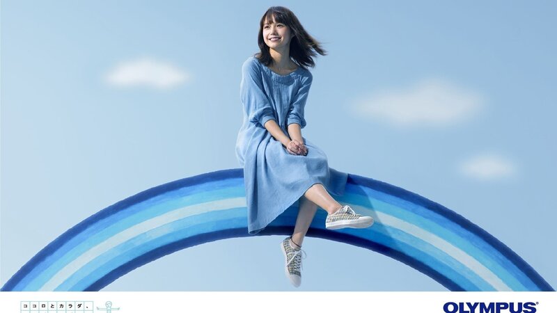 Woman sitting on a rainbow