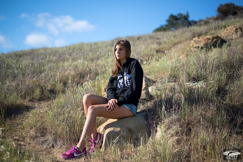 woman sitting on a rock