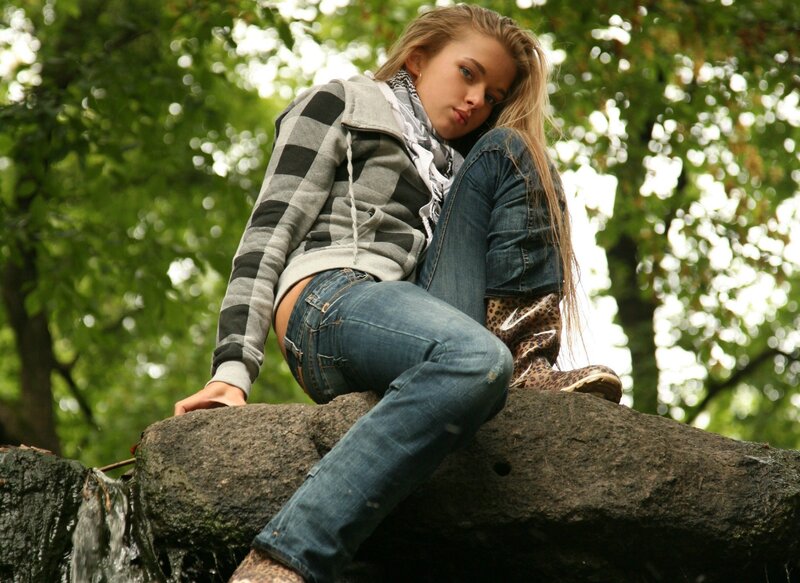 woman sitting on a rock