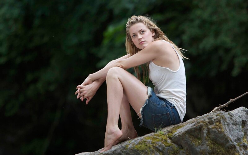 woman sitting on a rock