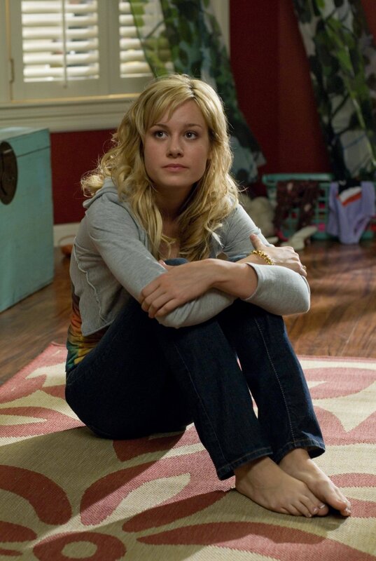 woman sitting on a rug