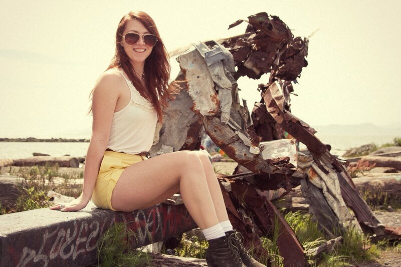 Woman sitting on a sculpture