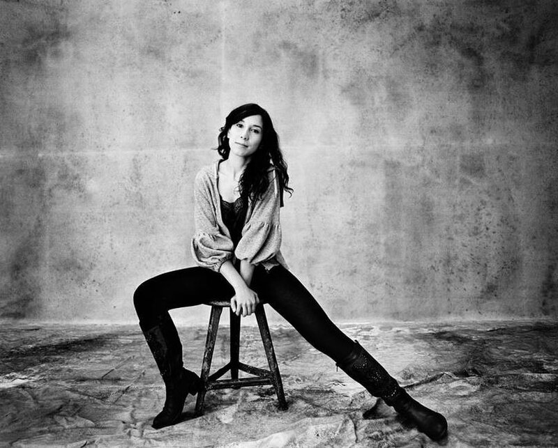 woman sitting on a stool