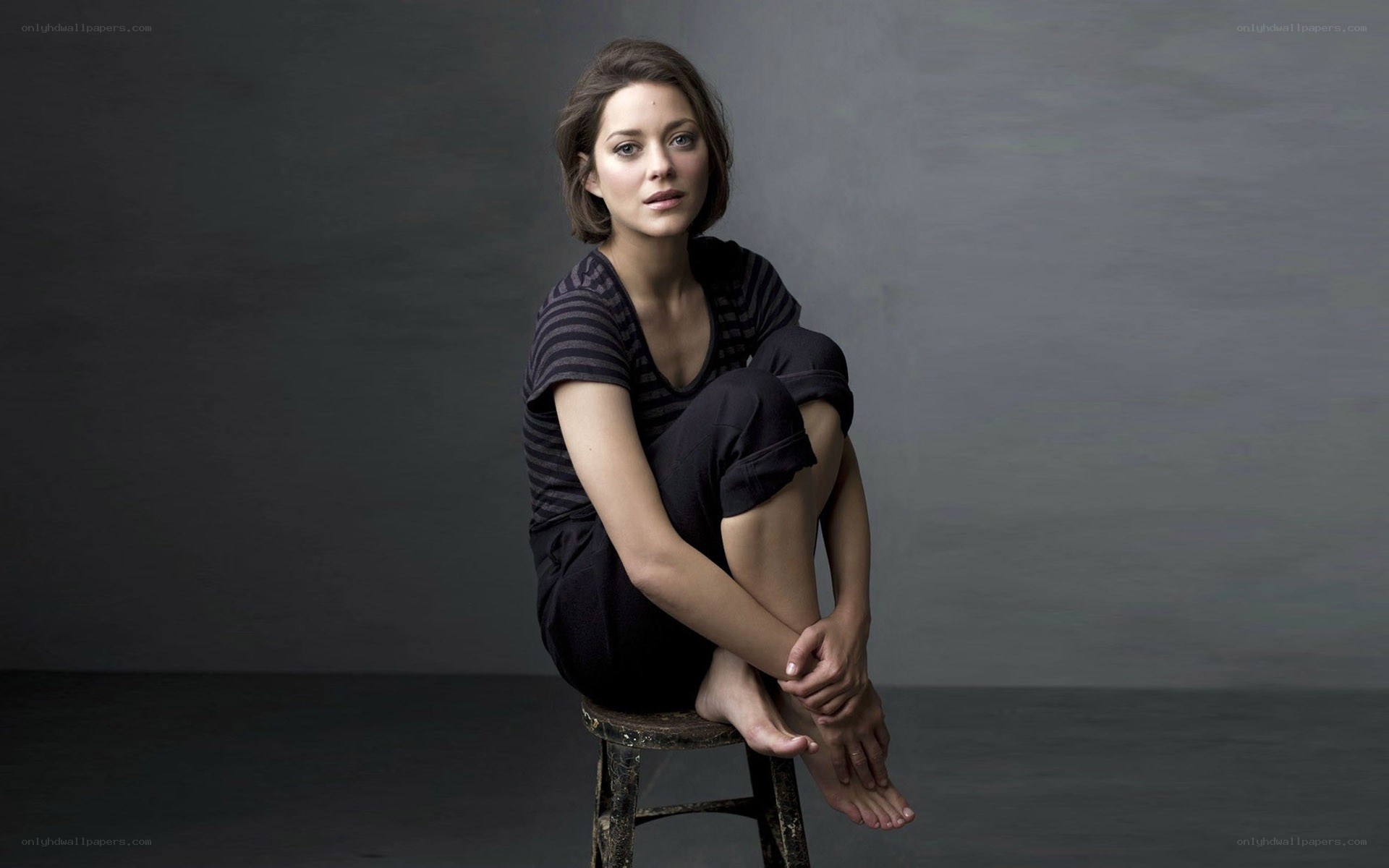 woman sitting on a stool