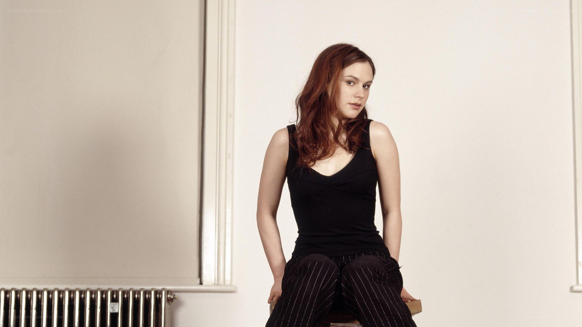 woman sitting on a stool