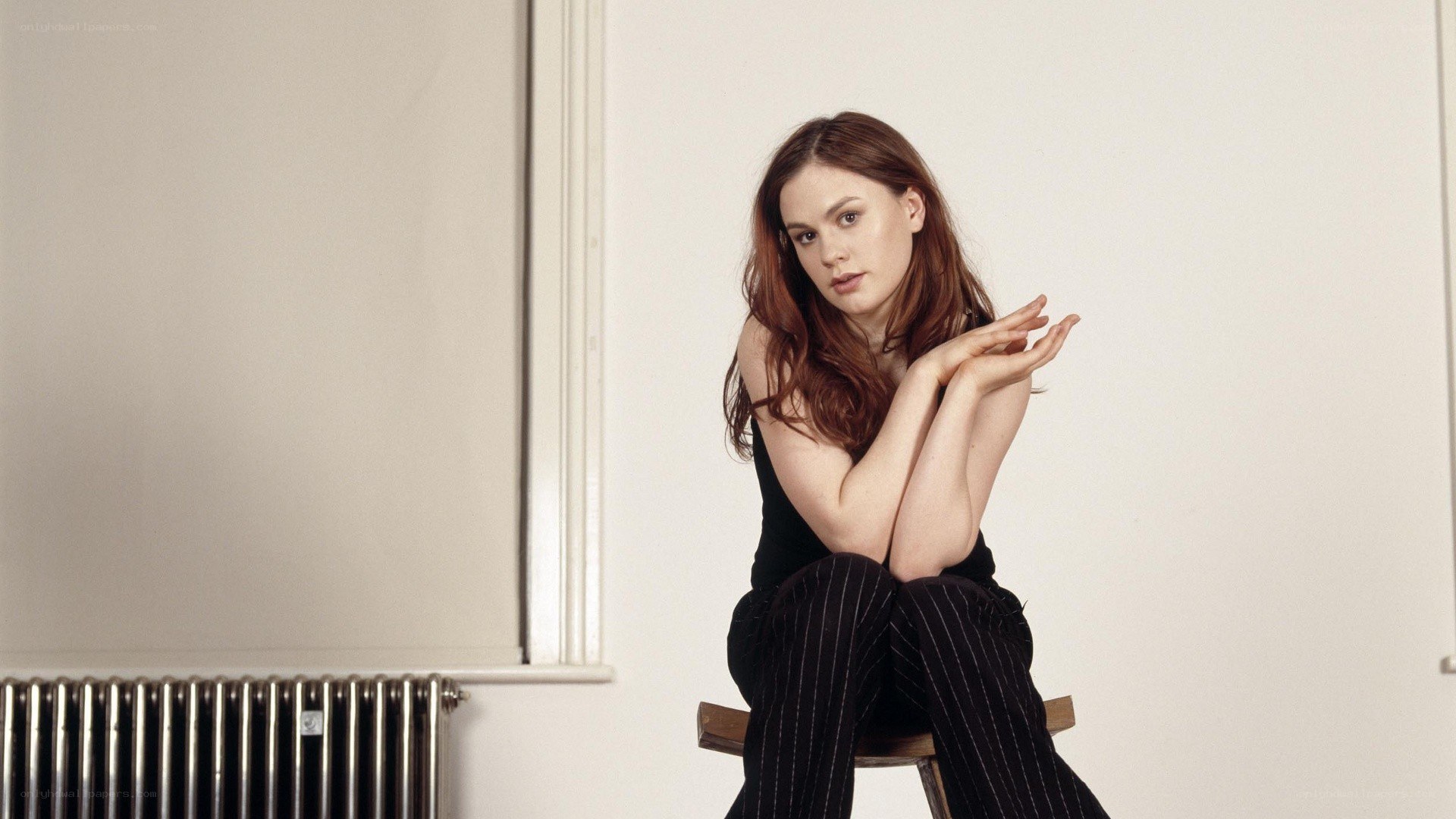 woman sitting on a stool