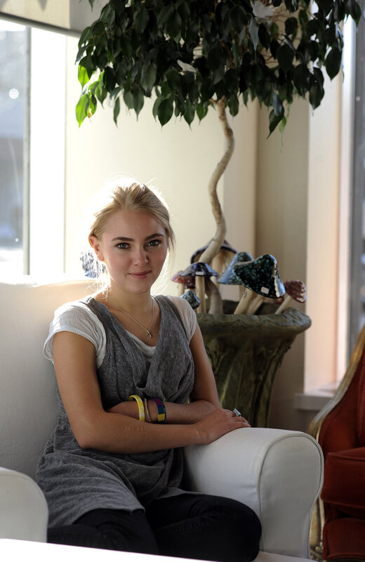 woman sitting on a white couch