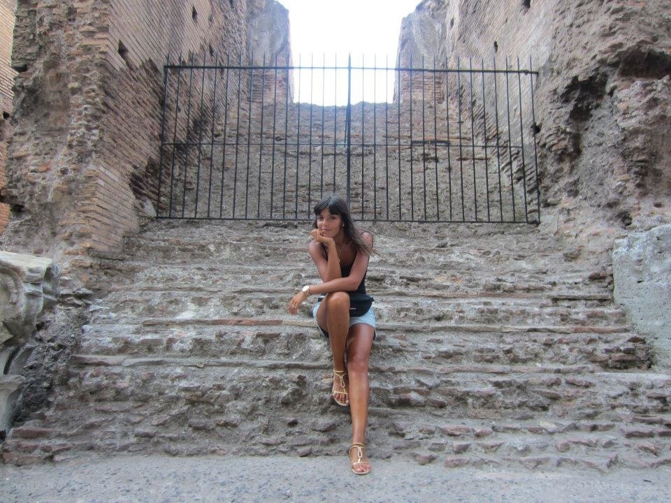 woman sitting on ancient steps