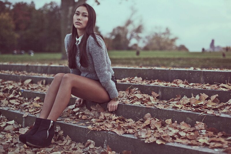 Woman sitting on autumn steps