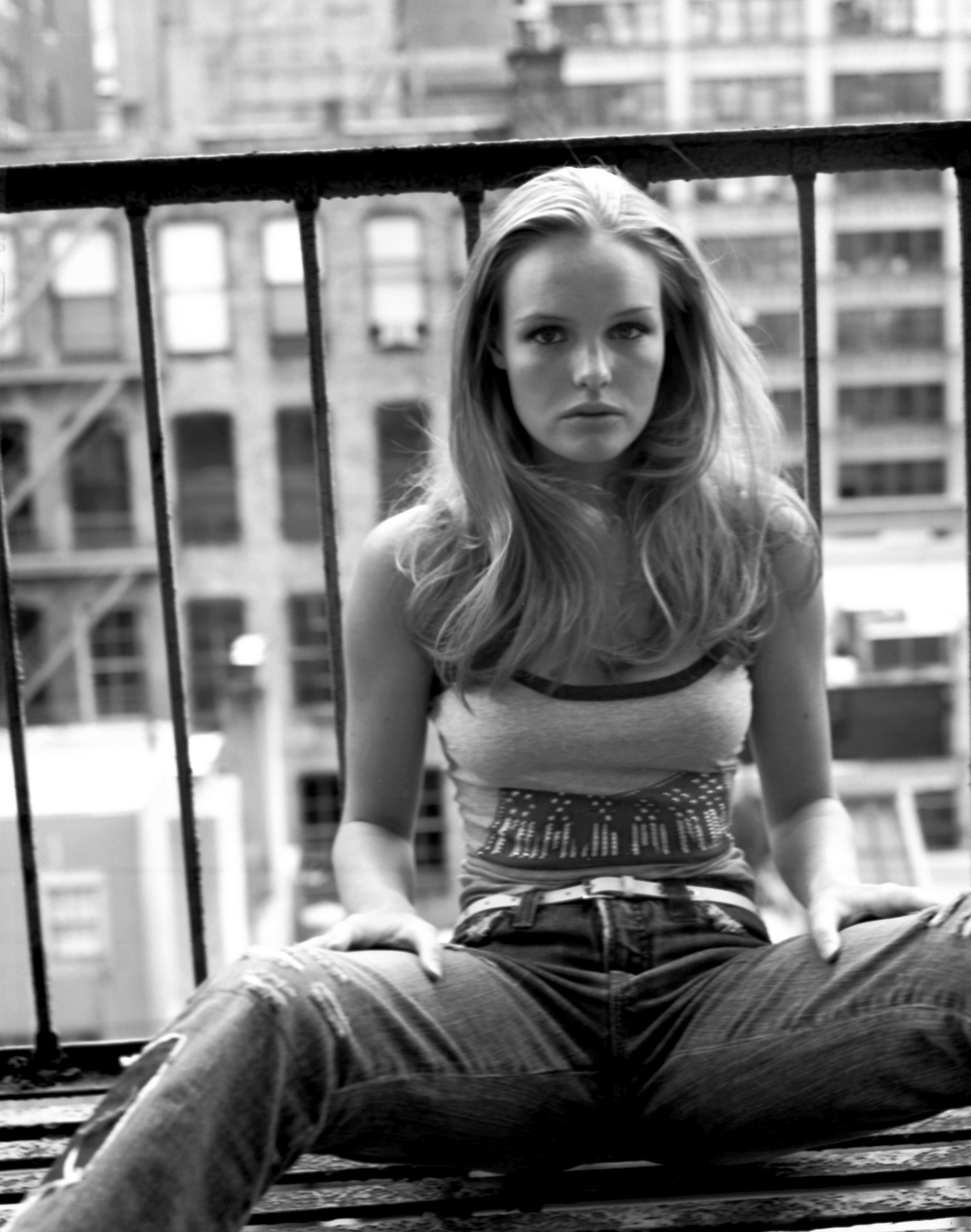 woman sitting on balcony