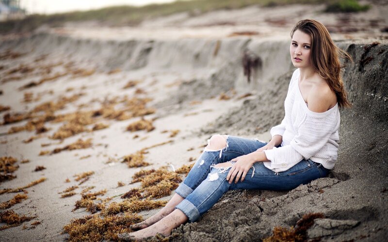 woman sitting on beach