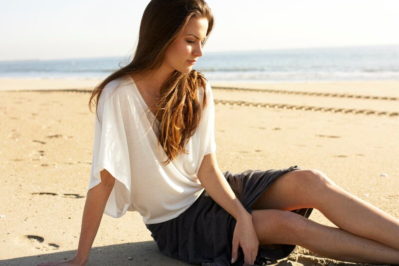 woman sitting on beach