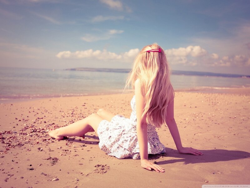 Woman sitting on beach