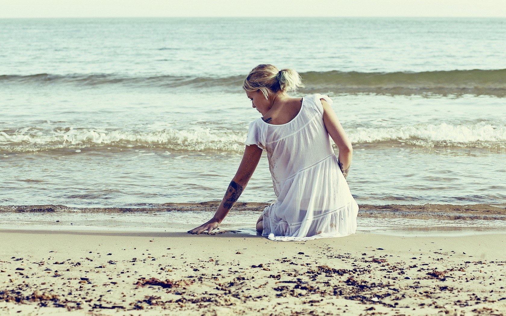 woman sitting on beach