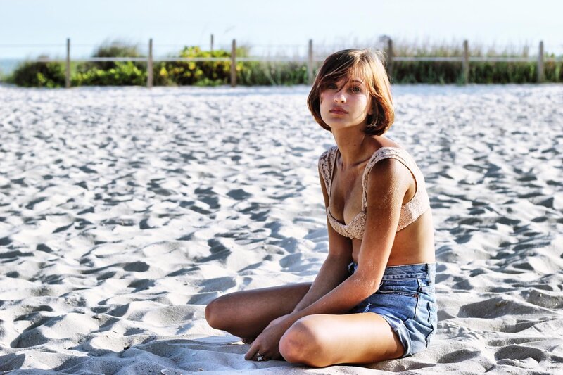 woman sitting on beach
