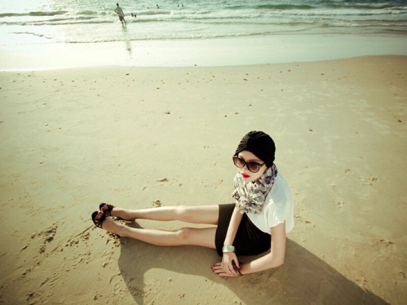woman sitting on beach