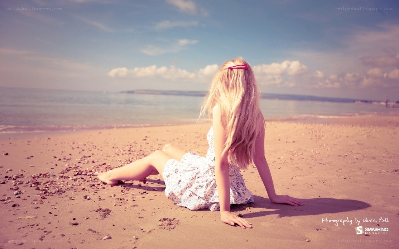 woman sitting on beach