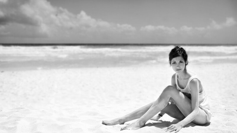 Woman Sitting on Beach — Black, Serene, Afternoon, Photograph, Sand