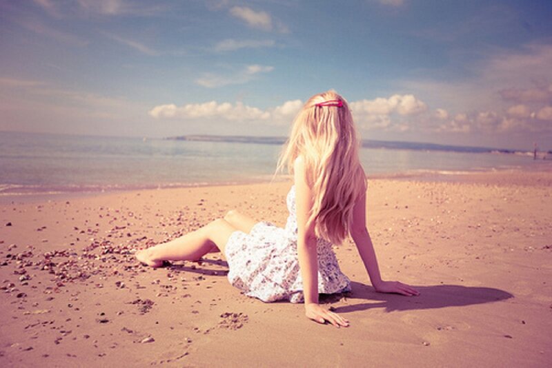 Woman Sitting on Beach — Blue, Serene, Afternoon, Photograph