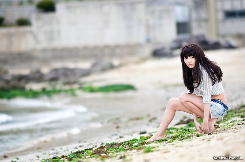 Woman Sitting on Beach — Green, Calm